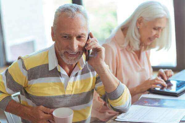 Mature man using mobile phone